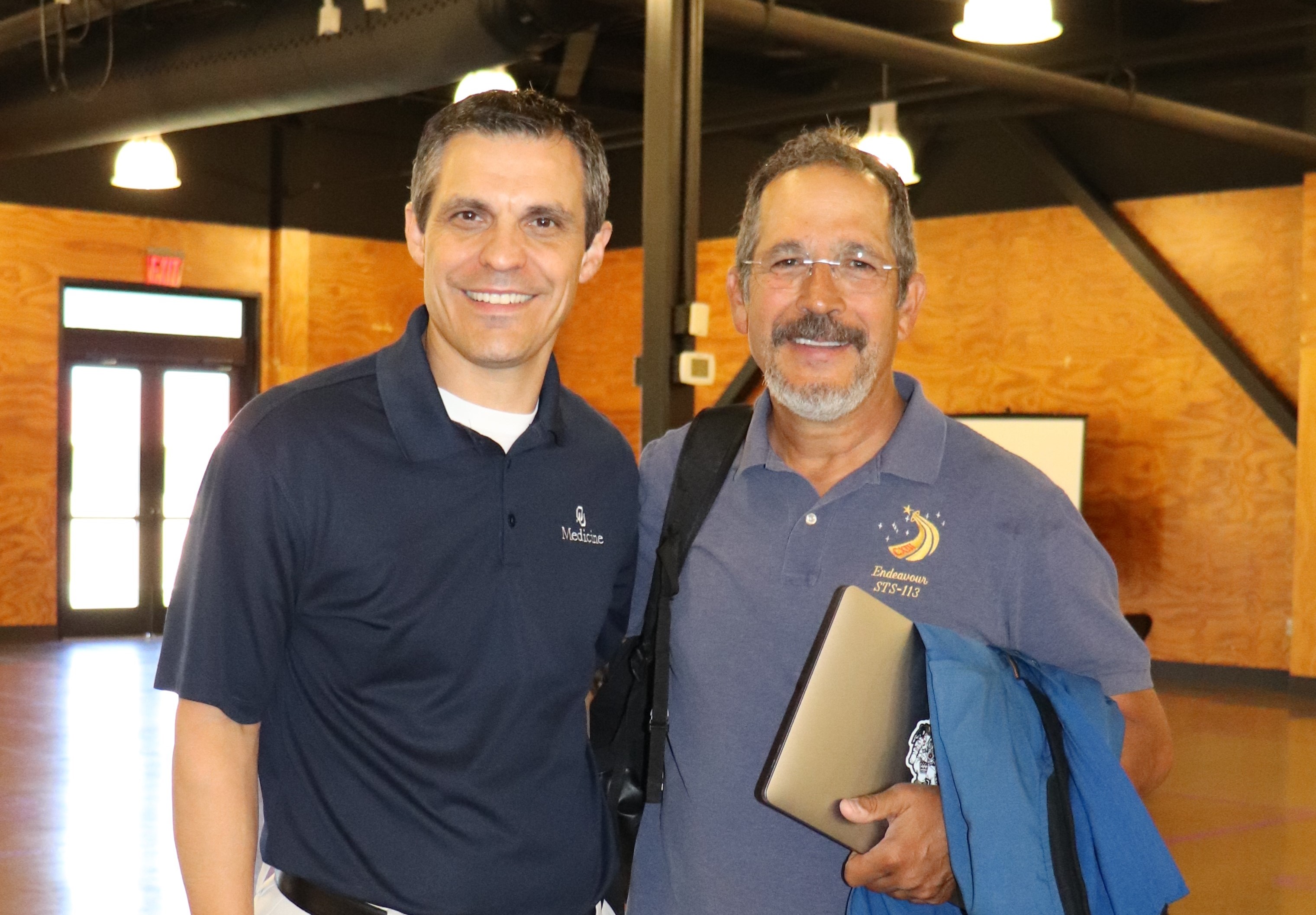Brown poses with John Carrington, the first Native American to visit space. Brown poses with John Carrington, the first Native American to visit space.